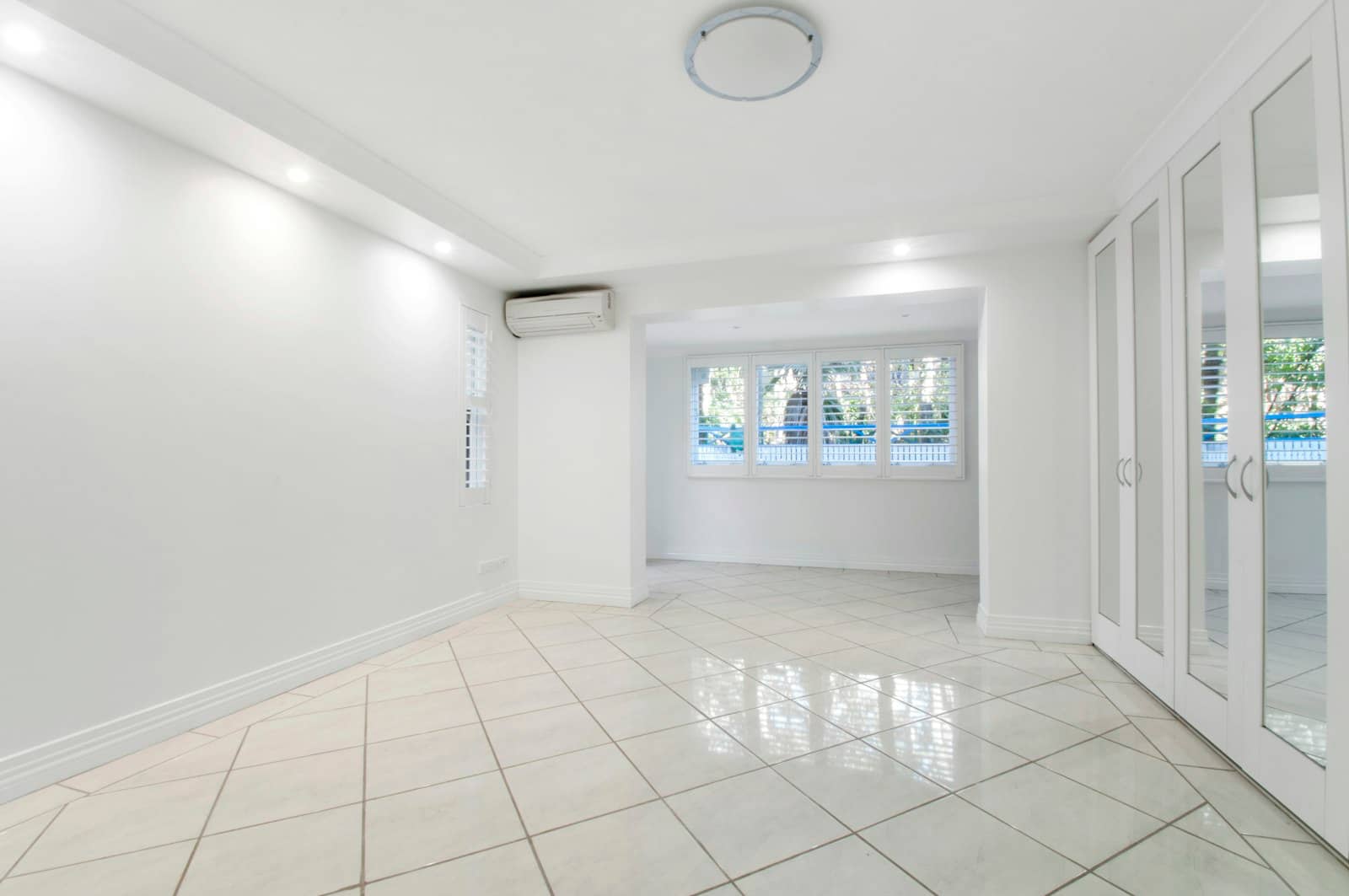 Bright empty room with a newly tiled floor